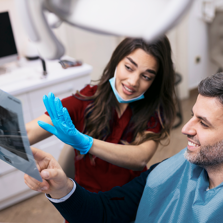 Dentist explaining an xray to a patient